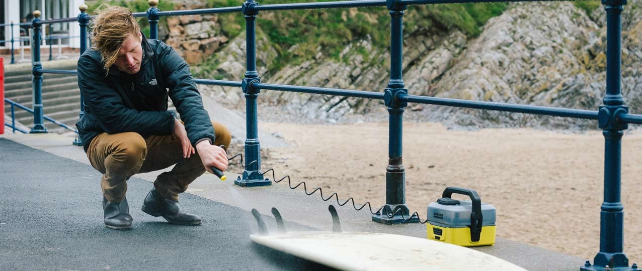 Rinsing Surfboard